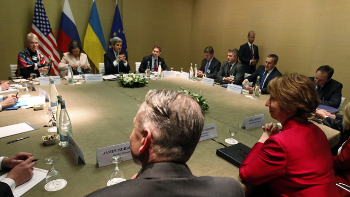 European Union foreign policy chief Catherine Ashton (in red) smiles at the start of a quadrilateral meeting with U.S. Secretary of State John Kerry (3rd L) and Ukraine's Foreign Minister Andrii Deshchytsia (3rd R) in Geneva, as representatives of the U.S., Ukraine, Russia and the European Union about the ongoing situation in Ukraine, April 17, 2014. (Reuters/Jim Bourg)