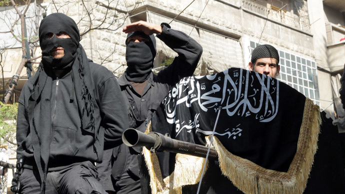 Members of jihadist group Al-Nusra Front take part in a parade calling for the establishment of an Islamic state in Syria, at the Bustan al-Qasr neighbourhood of Aleppo (AFP Photo)