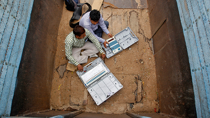 Polling officials check electronic voting machines in a truck after collection them at a distribution centre in the northern Indian city of Allahabad May 6, 2014 (Reuters / Jitendra Prakash)