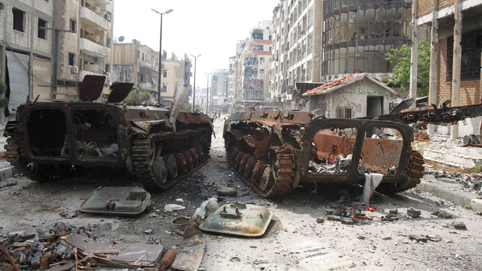 The wreckage of armoured personnel carriers belonging to the forces loyal to Syria's President Bashar al-Assad are seen at al-Hamdeya neighborhood in Homs city May 9, 2014.(Reuters / Khaled al-Hariri )