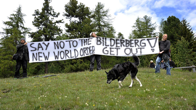 ARCHIVE PHOTO: Activists protest on June 9, 2011 in front of the Suvretta House five-star hotel in the chic Swiss ski station of St Moritz, where the Bilderberg Group is holding its annual meeting. (AFP Photo / Fabrice Coffrini)