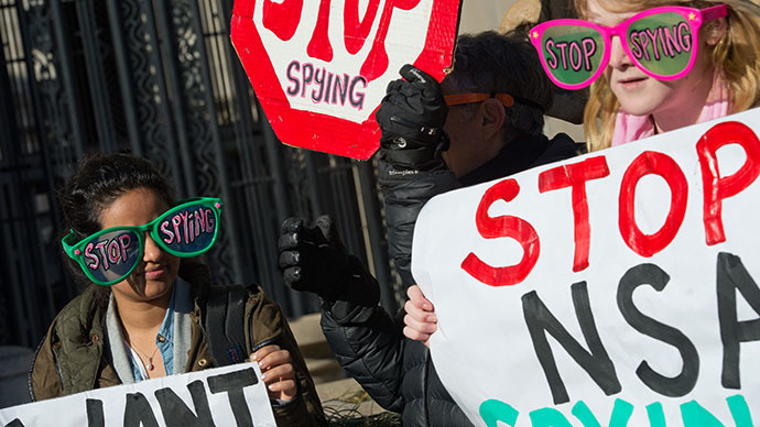 Civil liberties activists hold a rally against surveillance of US citizens as US President Barack Obama is expected to announce reforms of the National Security Agency (NSA) at the Justice Department in Washington on January 17, 2014 (AFP Photo / Nicholas Kamm)
