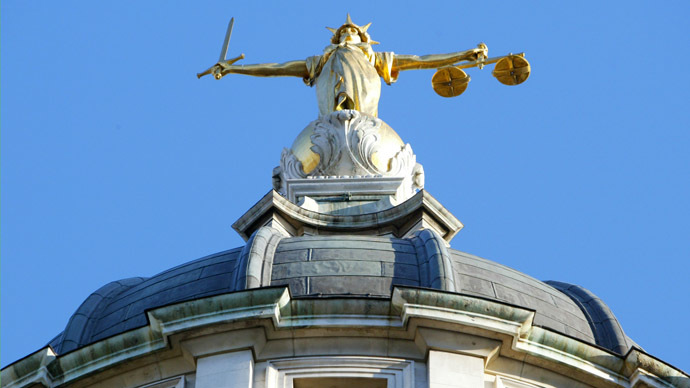The statue of justice stands on the copula of the Old Bailey courthouse (AFP Photo)