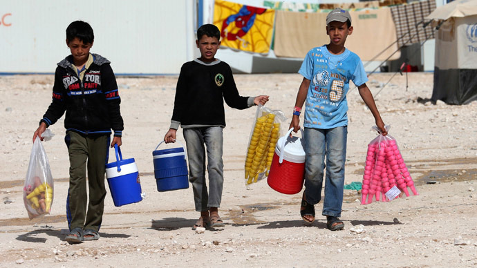 Syrian refugee children sell ice cream at Al Zaatri refugee camp in the Jordanian city of Mafraq, near the border with Syria.(Reuters / Muhammad Hamed )