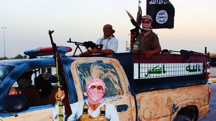 An image uploaded on June 14, 2014 on the jihadist website Welayat Salahuddin allegedly shows militants of the Islamic State of Iraq and the Levant (ISIL) riding in a captured vehicle left behind by Iraqi security forces at an unknown location in the Salaheddin province. (AFP Photo)