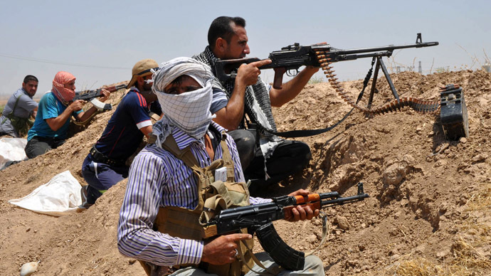 Iraqi Shi'ite Turkmen fighters take part in an intensive security deployment in the town of Taza, south of the northern oil city of Kirkuk, June 19, 2014. (Reuters)