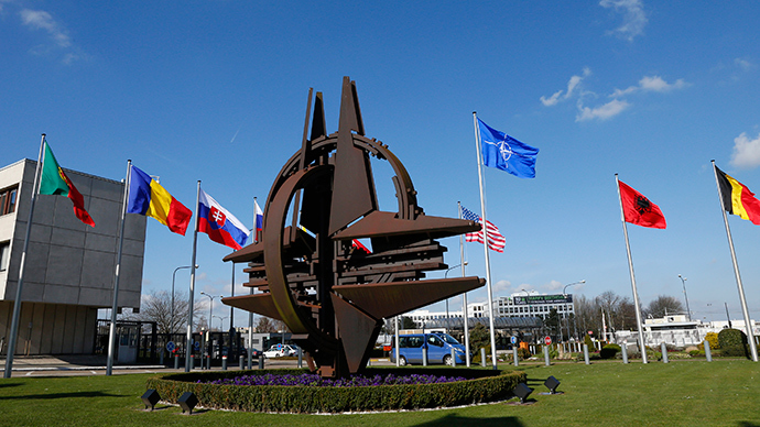 Flags fly at the Alliance headquarters in Brussels during a NATO ambassadors meeting on the situation in Ukraine (Reuters / Yves Herman)