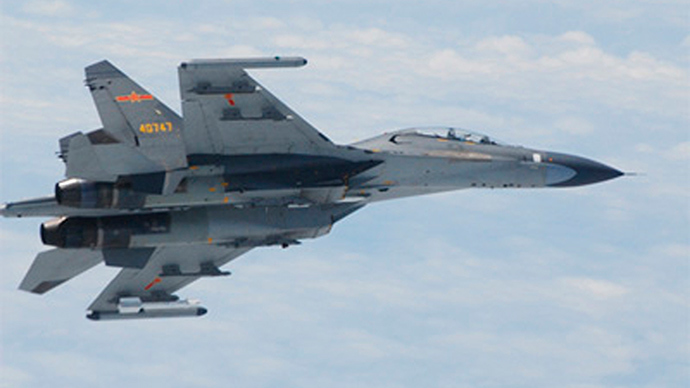A Chinese SU-27 fighter jet flies over the East China Sea, in this handout photo taken June 11, 2014 and released by the Defense Ministry of Japan June 11, 2014 (Reuters)