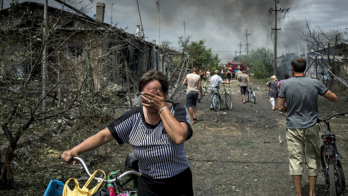 The site of the second strike by Ukrainian military on densely-populated residential areas in the Lugansk Region looked even worse than the first. Nine people died and 11 were wounded in the attack, said the head of the local administration, Vladimir Bilous (RIA Novosti / Valeriy Melnikov)