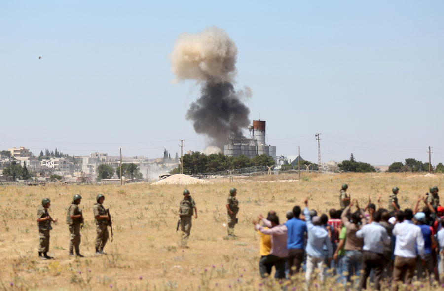 Kobani, Turkish border town of Suruc in Sanliurfa province, Turkey, June 25, 2015. © Ali Sahin