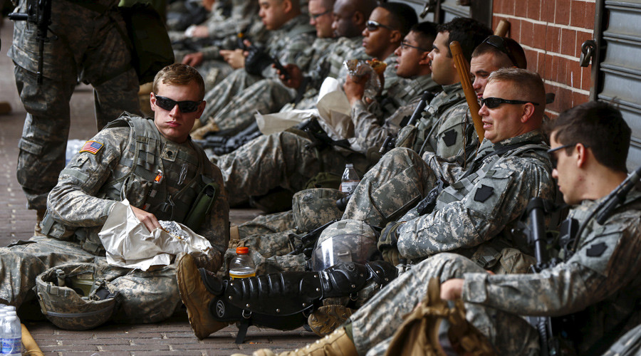 US lawmakers push to repeal military gun ban after deadly attacks