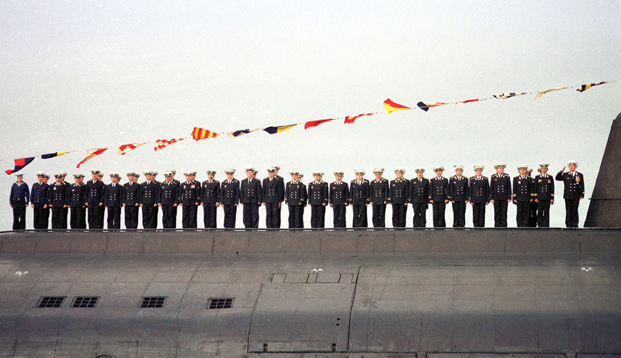 A July 30, 2000 file picture shows the crew of the sunken Russian submarine Kursk lead by Captain Grigory Lyachin (R) during a naval parade which was held in Severomorsk. © Reuters