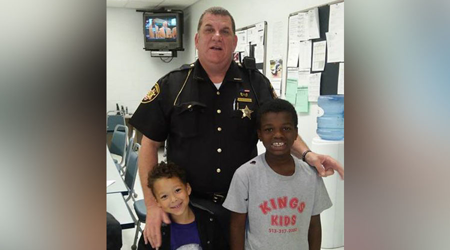 ‘He’s like a friend to me’: Cop spends own money on hotel, shoes, food for homeless family