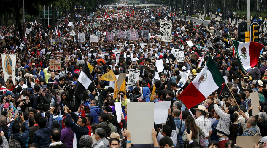 Demonstrators take part in a march to mark the first anniversary of the disappearance of the 43 students from Mexico's Ayotzinapa College Raul Isidro Burgos, in Mexico City, September 26, 2015. © Henry Romero