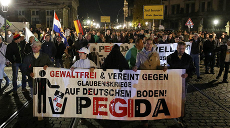 Supporters of the anti-immigration rightwing movement PEGIDA (Patriotic Europeans Against the Islamisation of the West) march during their weekly gathering in the historic part of Dresden, Germany October 26, 2015. © Fabrizio Bensch