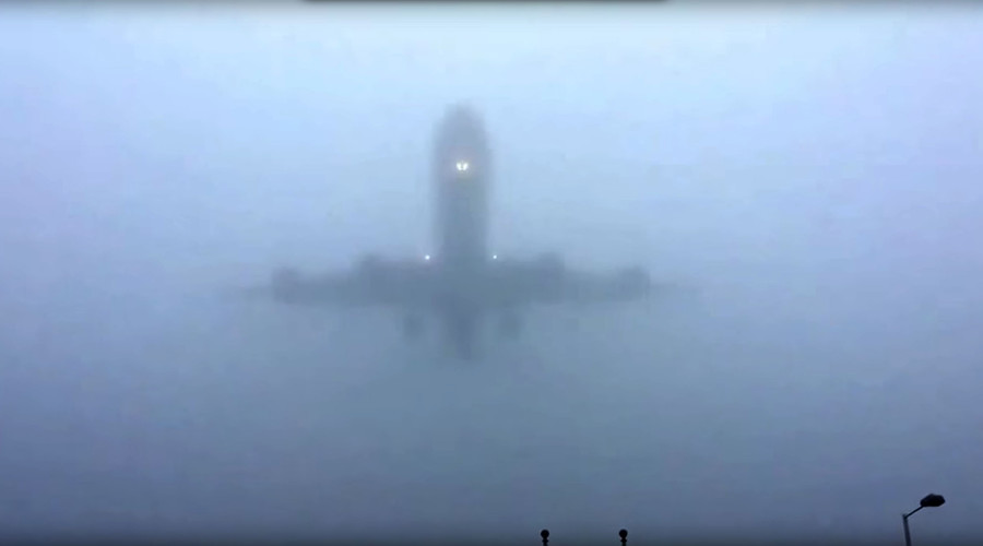 The mists of Avalon? Planes flying out of thick fog at Heathrow Airport (VIDEO)