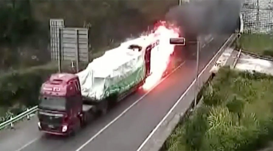 Courageous truck driver barrels through tunnel as vehicle erupts in flames (VIDEO)