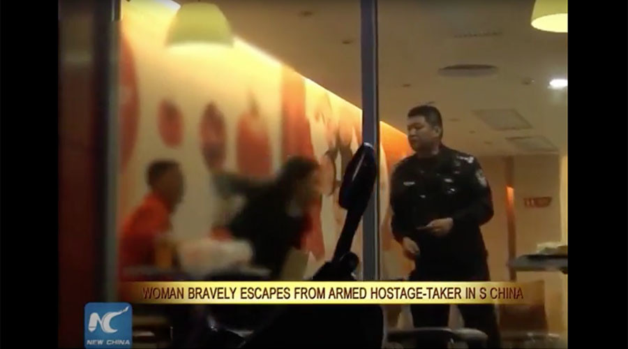 Leap for life: Knife-threatened hostage escapes near death, watch her run free (VIDEO)
