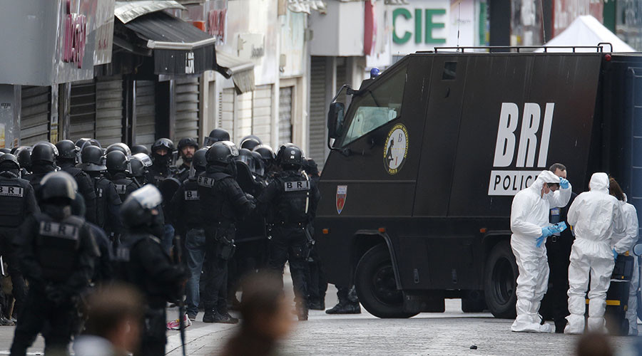 Paris shootout: 2 dead, incl. female suicide bomber, 7 arrested as police, army hunt suspects