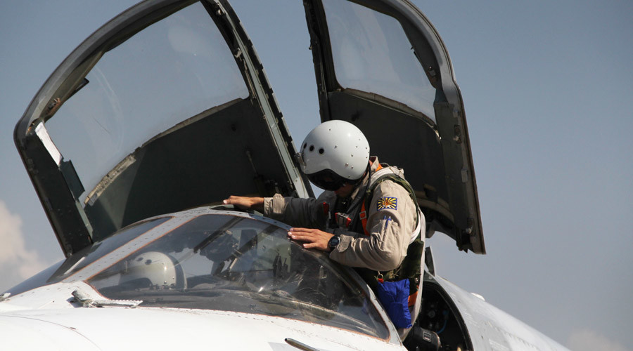 A Russian pilot gets into a Su-24 aircraft before taking off at the Khmeimim airbase in Syria. © Dmitriy Vinogradov