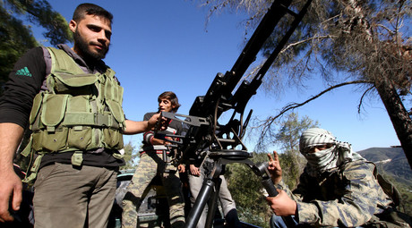 Syrian Turkmen fighters are seen with an anti-aircraft artillery weapon near the northern Syrian village of Yamadi, near the Turkish-Syrian border, Syria, November 24, 2015. © Stringer
