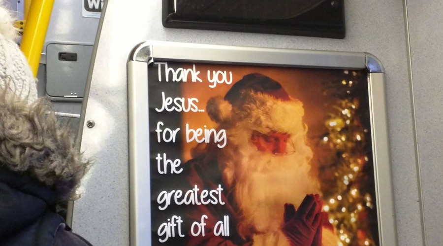 Putting Christ back into Christmas: Santa prays to Jesus in bus ad