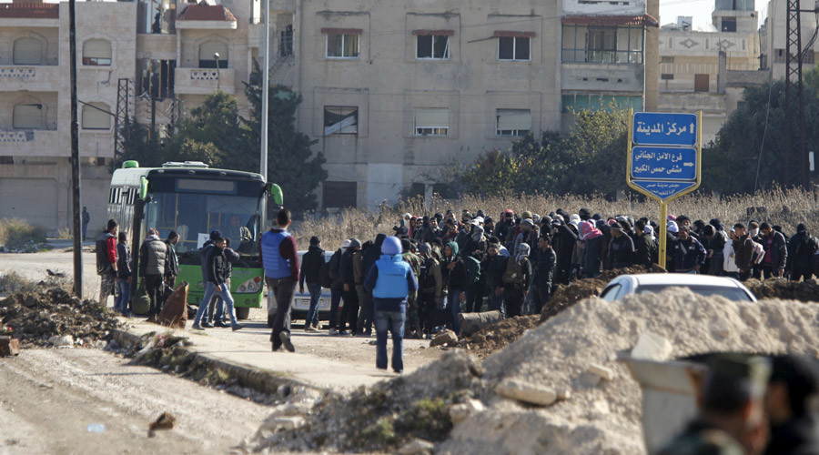 Syrian rebels leaving Homs under truce deal