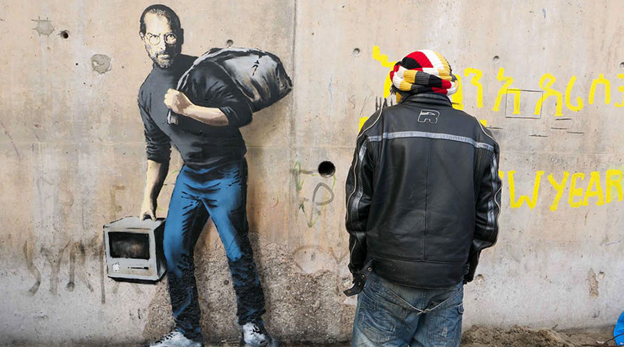 Banksy’s ‘Steve Jobs the Son of Syrian Migrant’ pops up in Calais camp