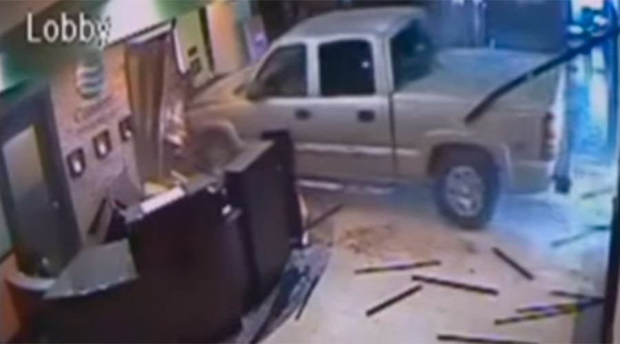 Angry man narrowly misses workers when driving into hotel lobby (VIDEO)