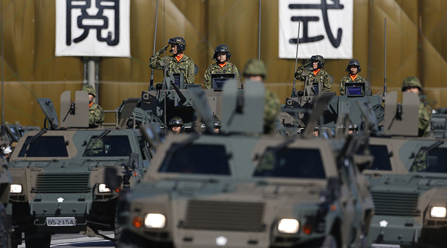 Japan cabinet approves record military budget aiming at tighter spying co-op with US