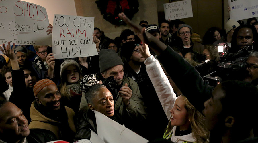 Anti-violence protesters march through streets of Chicago on New Year Eve