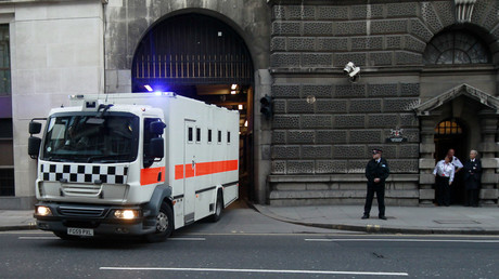 A prison van leaves under armed escort after the verdict in the Lee Rigby murder trial at the Old Bailey in central London, December 19, 2013. © Luke MacGregor 
