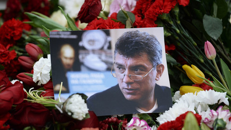 Flowers and a picture at a murder scene of politician Boris Nemtsov, who was shot dead on Moscow's Moskvoretsky bridge in the early hours of February 28, 2015. © 