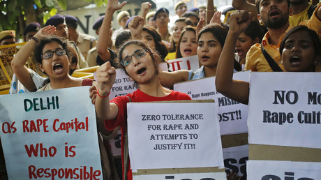 Members of All India Students Association (AISA) shout slogans as they hold placards during a protest outside police headquarters in New Delhi, India © Anindito Mukherjee