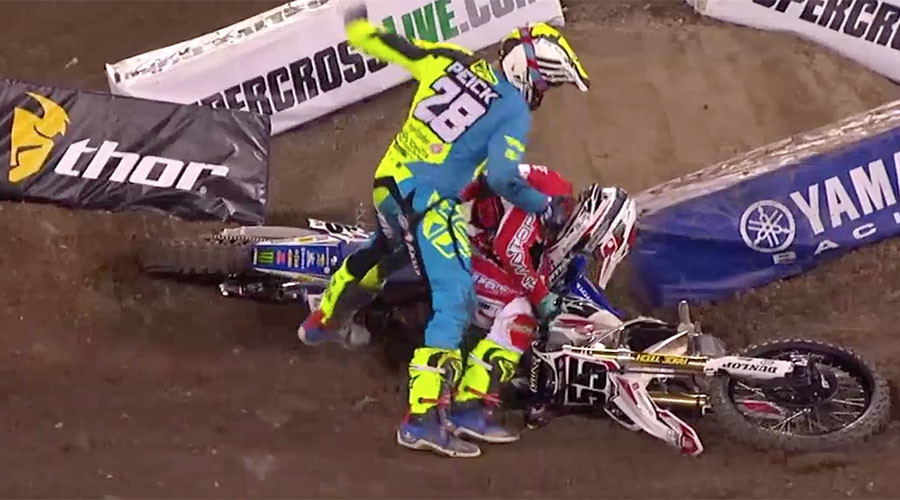 Irate motocross rider punches fellow competitor after crash (VIDEO)