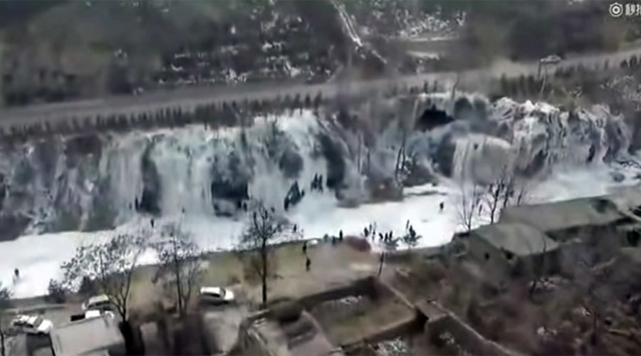 Elsa’s dream: Frozen waterfall the width of football pitch captured in China (VIDEO)