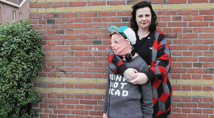 Wooly Weirdness: Mother knits life-size onesie of her own sons (PHOTOS)