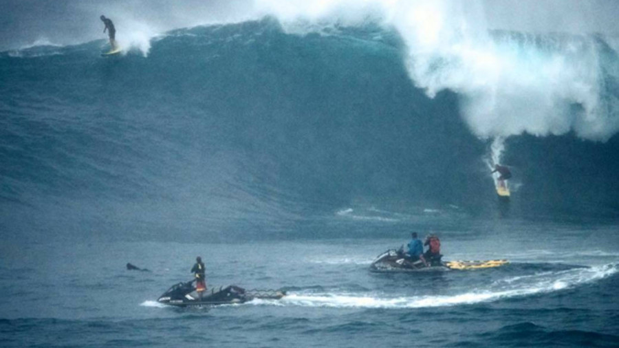 Cowabunga: Hawaii surfers ignore warnings to hit monster swells