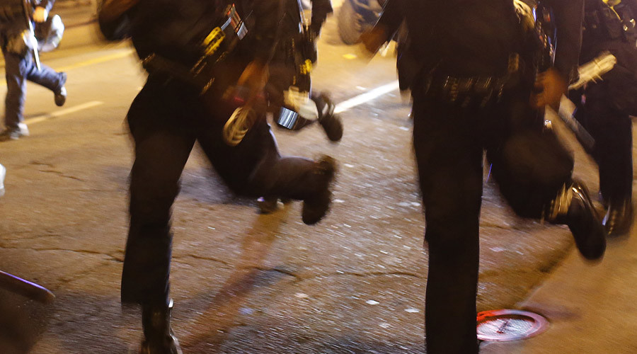 Police officers flee angry mob in Swedish refugee center through back door