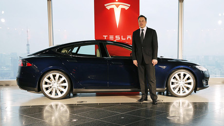 Tesla Motors Inc Chief Executive Musk poses with a Tesla Model S electric car © Toru Hanai