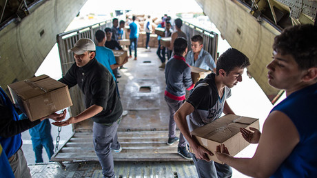 FILE PHOTO. Unloading Russian EMERCOM plane with humanitarian aid which arrived to Latakia Airport in Syria. © Andrey Stenin