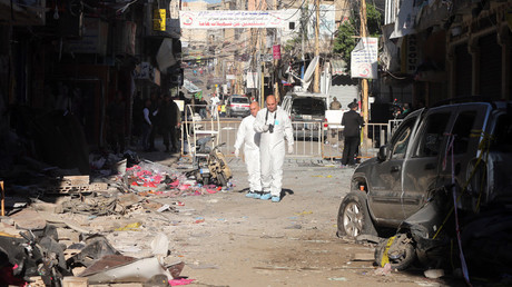 Lebanese forensic police investigate the site of a twin bombing attack that rocked a busy shopping street in the area of Burj al-Barajneh, a Beirut stronghold of Lebanon's Shiite movement Hezbollah, the day after the attack on November 13, 2015. © AFP