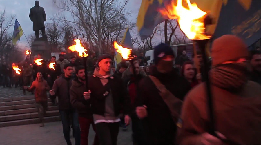 Ukrainian far-right fighters hold Nazi-inspired torch march in Odessa to commemorate slain friends