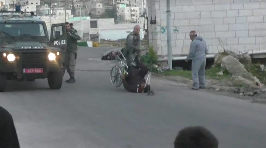 Israeli border police officer flips Palestinian man from wheelchair (VIDEO)