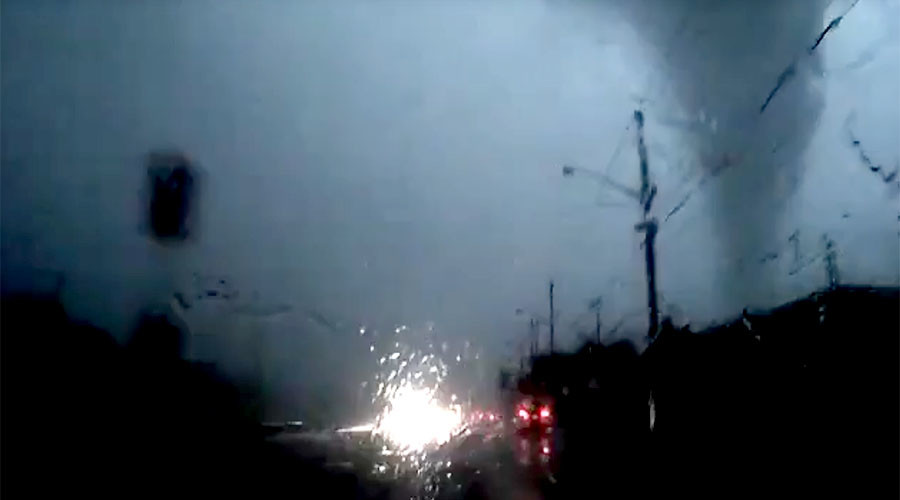 ‘Did not see that coming’: Driver careers inches from tornado, claims not to have noticed it (VIDEO)