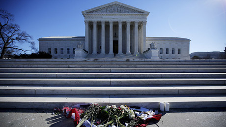 Flowers are seen in front of the Supreme Court building in Washington D.C. after the death of U.S. Supreme Court Justice Antonin Scalia, February 14, 2016. © Carlos Barria