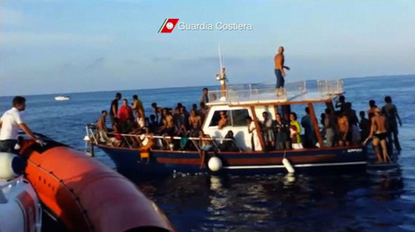 A still image taken from video released on October 4, 2013 by the Italian Coastguard shows migrants rescued from the water off the southern Italian island of Lampedusa on Thursday October 3, 2013. © Italian Coast Guard