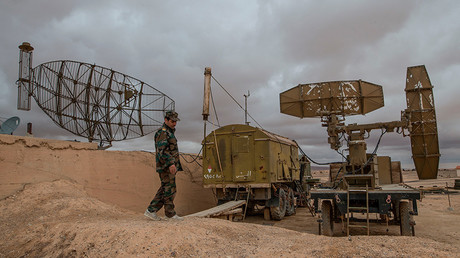 A Syrian soldier examines radar systems at the Syrian Air Force base in the Homs Province © Iliya Pitalev