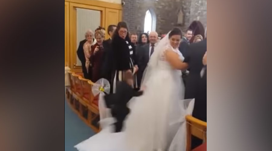 Ninja kid attacks wedding dress while bride walks down the aisle (VIDEO)