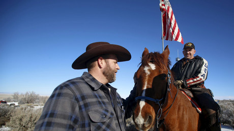 Ldeader of a group of armed protesters Ammon Bundy (L) greets occupier Duane Ehmer and his horse Hellboy at the Malheur National Wildlife Refuge near Burns, Oregon, January 8, 2016. © Jim Urquhart 